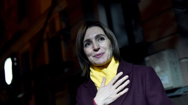 Moldova's presidential candidate Maia Sandu gestures as she leaves the Action and Solidarity Party office in Chisinau, early on November 16, 2020, following her victory in the second round of the country's presidential election. Sergei GAPON / AFP