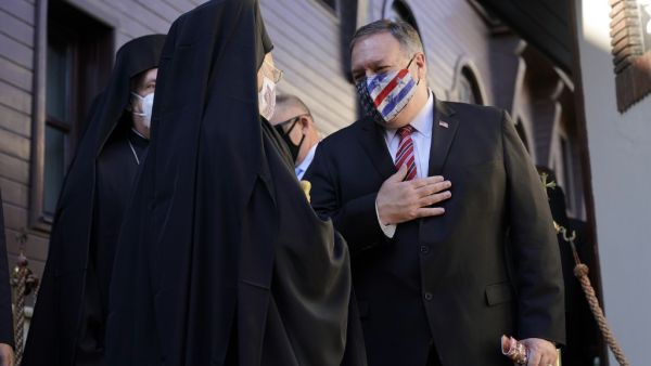 U.S. Secretary of State Mike Pompeo (R) gestures as he speaks with Ecumenical Patriarch Bartholomew I, the spiritual leader of the world's Orthodox Christians, as he departs The Patriarchal Church of St. George in Istanbul on November 17, 2020. AFP