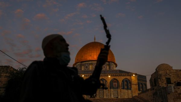 A Palestinian man is pictured outside the Dome of the Rock in the al-Aqsa mosque compound, Islam's third holiest site, in the old city of Jerusalem on November 18, 2020. AHMAD GHARABLI / AFP
