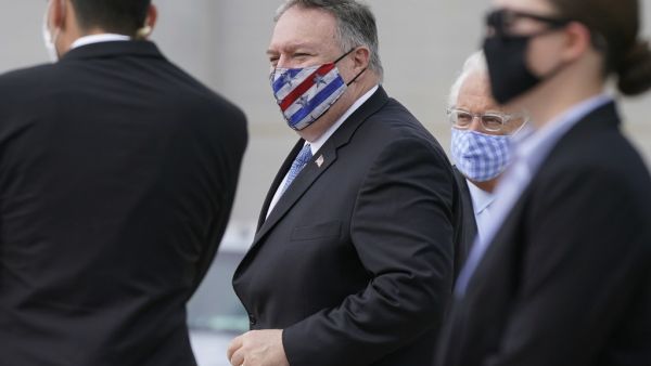 US Secretary of State Mike Pompeo prepares to board a plane at Ben Gurion Airport near Tel Aviv on November 20, 2020. US Secretary of State Mike Pompeo became the first top American diplomat to visit a West Bank Jewish settlement and the Golan Heights, cementing Donald Trump's strongly pro-Israel legacy. Patrick Semansky / POOL / AFP