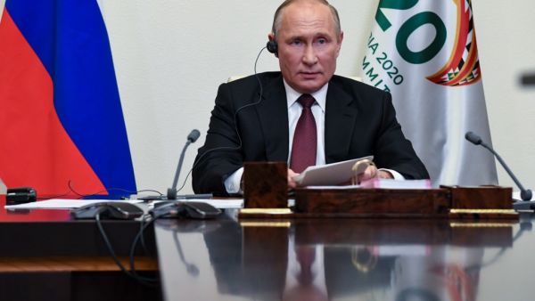 Russian President Vladimir Putin attends the G20 summit hosted by Saudi Arabia via video conference at the Novo-Ogaryovo state residence, outside Moscow, Russia, on November 21, 2020. AFP