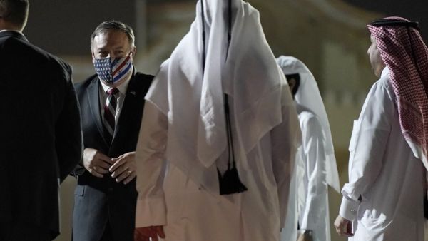 US Secretary of State Mike Pompeo prepares to board his plane at the Old Doha International airport in the Qatari capital Doha, on November 21, 2020. Pompeo met with negotiators from the Afghan government and the Taliban in Qatar, and will finish his tour with a stop in Saudi Arabia. Patrick Semansky / POOL / AFP US Secretary of State Mike Pompeo prepares to board his plane at the Old Doha International airport in the Qatari capital Doha, on November 21, 2020. Pompeo met with negotiators from the Afghan government and the Taliban in Qatar, and will finish his tour with a stop in Saudi Arabia. Patrick Semansky / POOL / AFP