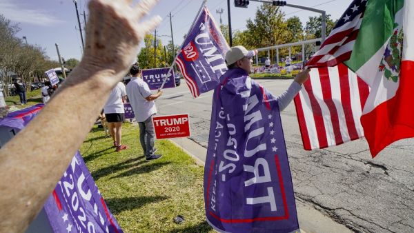 Americans head to the polls on the last day to cast their vote for incumbent U.S. President Donald Trump or Democratic nominee Joe Biden in the 2020 presidential election. Sandy Huffaker/Getty Images/AFP
