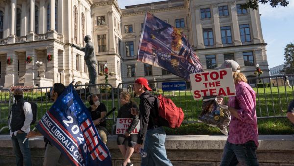 Supporters of Donald Trump host a 'Stop the Steal' protest outside of the Georgia State Capital building on November 21, 2020 in Atlanta, Georgia. Georgia finished the hand recount of ballots which confirmed President-elect Joe Biden's win in the state. Megan Varner/Getty Images/AFP