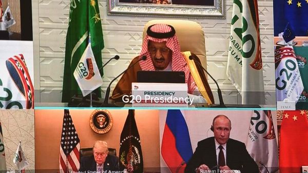 Pictured; President Trump (bottom left) was virtually seated next to Russian President Vladimir Putin during Saturday morning's G20 summit, which could be his last. (AFP/File)