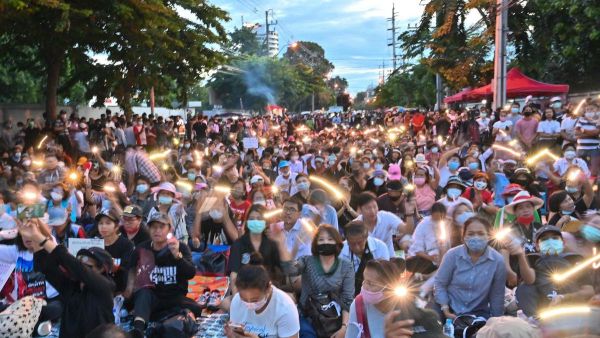 Anti-government protesters take part in a pro-democracy rally outside Thailand's parliament in Bangkok on 24 September, to demand a new constitution. Mladen Antonov / AFP