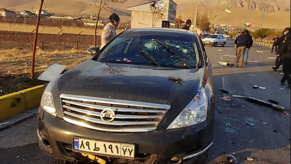 Pictures from the scene show a black car peppered with bullets and blood-soaked. (AFP)