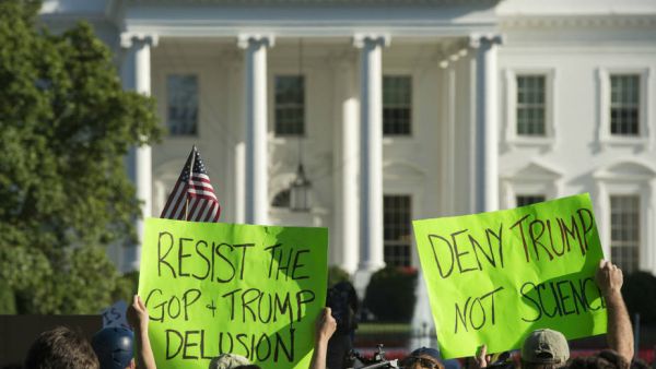 Trump said the United States won't be bound by any of the treaty's obligations while he backs out of the Paris Agreement. The crowd outside the White House for the announcement wasn't pleased. Credit: Andrew Caballero-Reynolds/AFP/Getty Images