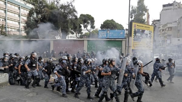 Members of Lebanon's security forces deploy amid clashes with demonstrators at a rally called by an Islamist group to protest comments by the French President seen as offensive to Islam, near the residence of the French Ambassador in the capital Beirut, on October 30, 2020. JOSEPH EID / AFP