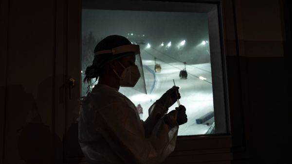 A nurse holds a swab test at the Covid Testing Position organized by the International Ski Federation (FIS) on the eve of its World Cup event on December 4, 2020 in Santa Caterina Valfurva, Northern Italy. Marco Bertorello / AFP