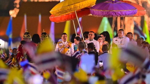 Thailand's King Maha Vajiralongkorn (C) looks at royalist supporters during a ceremony to commemorate the birthday of his father the late Thai king Bhumibol Adulyadej at Sanam Luang in Bangkok on December 5, 2020. Lillian SUWANRUMPHA / AFP