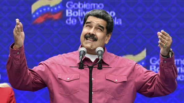 Venezuelan President Nicolas Maduro gestures while delivering a press conference at a polling station in the Simon Rodriguez school in Fuerte Tiuna, Caracas, on December 6, 2020 during Venezuela's legislative elections. AFP