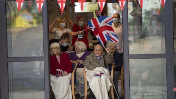 Residents wait to greet Britain's Catherine, Duchess of Cambridge and Britain's Prince William, Duke of Cambridge as they visit Cleve Court Care Home in Bath in south west England to pay tribute to the efforts of care home staff throughout the COVID-19 pandemic, on December 8, 2020, on the final day of engagements on their tour of the UK. Paul Grover / POOL / AFP