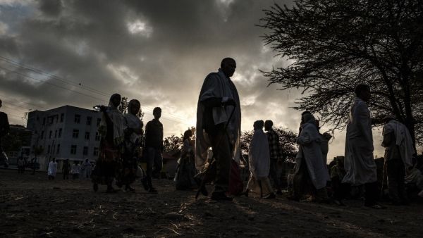 Ethiopian Orthodox worshippers walk towards the Eyesus Church in the city of Alamata, Ethiopia, on December 12, 2020. EDUARDO SOTERAS / AFP