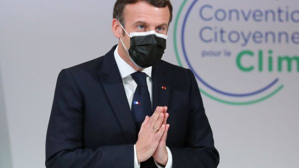 French President Emmanuel Macron gestures as he attends a meeting with members of the Citizens' Convention on Climate (CCC) about their proposals to fight against global warming, in Paris on December 14, 2020. Thibault Camus / POOL / AFP
