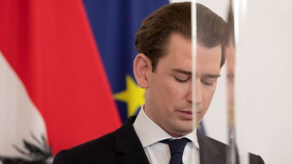 Austrian Federal Chancellor Sebastian Kurz is seen through a plexiglass screen as he delivers a press statement after a video conference with the provincial governor about the further tightening of lockdown measures, at the Federal Chancellery in Vienna on December 18, 2020. Austria will enter its third coronavirus lockdown between December 26 and January 24, Chancellor Kurz announced on December 18, as the country fights to bring down its infection rate. ALEX HALADA / AFP