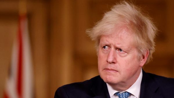 Britain's Prime Minister Boris Johnson speaks during a virtual press conference inside 10 Downing Street in central London on December 21, 2020, after a string of countries banned travellers and all but unaccompanied freight arriving from the UK, due to the rapid spread of a new, more-infectious coronavirus strain. Countries around the world closed their borders to Britain Monday in a race to contain a fast-spreading variant of the coronavirus as the European Union neared approval of its first jab for the b