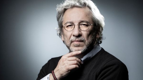 This file photo taken on September 10, 2018 during a photo session in Paris shows Turkish prominent journalist Can Dundar, exiled in Germany, who has been sentenced to more than 27 years in jail by a Turkish court on charges of aiding a terror group and espionage, local media reported on December 23, 2020. The court in Istanbul found Dundar, who served as editor-in-chief of the opposition Cumhuriyet daily before fleeing to Germany in 2016, guilty over a story about an arms shipment intercepted at the Syrian