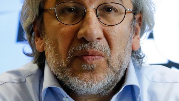 In this file photo taken on September 28, 2018 Can Dundar, Turkish journalist and former chief editor of the Turkish daily newspaper Cumhuriyet addresses a press conference in Berlin. A Turkish court on December 23, 2020 sentenced the exiled former editor-in-chief of the opposition Cumhuriyet daily to more than 27 years in jail on charges of aiding a terror group and espionage. The court found Can Dundar -- who fled to Germany in 2016 -- guilty in connection with a story about an alleged Turkish arms shipme