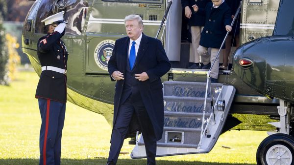U.S. President Donald Trump, followed by his grandchildren, Arabella Kushner, Theodore Kushner, and Joseph Kushner get off Marine One on the south lawn of the White House on November 29, 2020 in Washington, DC. President Trump spent the weekend at Camp David and at Trump National Golf Club in Sterling, Virginia. Tasos Katopodis/Getty Images/AFP