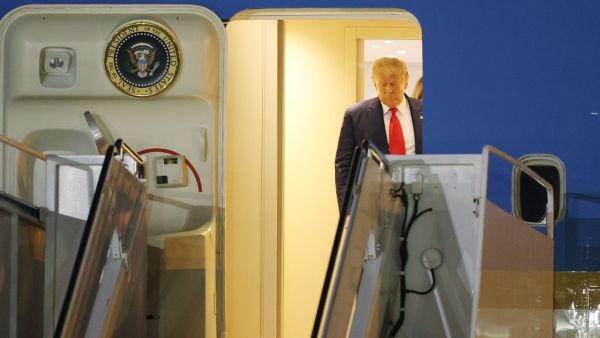 President Donald Trump prepares to exit from Air Force One at the Palm Beach International Airport on December 23, 2020 in West Palm Beach, Florida. President Trump is scheduled to enjoy a 10-day holiday visit at his Mar-a-Lago resort during the last Christmas of his precedency. Joe Raedle/Getty Images/AFP JOE RAEDLE / GETTY IMAGES NORTH AMERICA / Getty Images via AFP