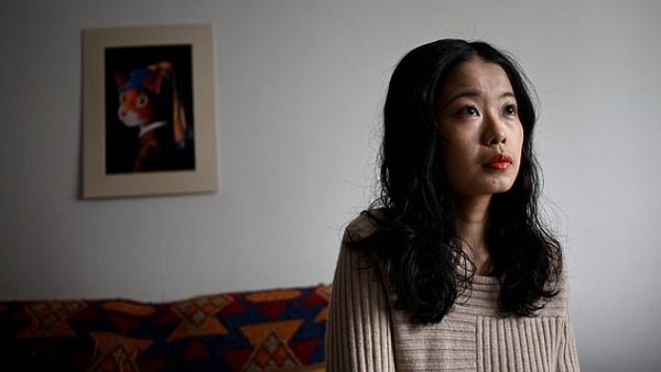 Zhou Xiaoxuan (pictured today at her home) announced the trial for her lawsuit, which was delayed for two years and reflects the challenges Chinese women have in pursuing sexual misconduct complaints despite the spread of the global #MeToo movement. (AFP/File)