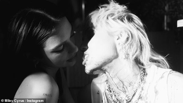 Racy images: Miley Cyrus, right, took to Instagram late Thursday night to share a snap of herself teasing a kiss with Dua Lipa, left. (Instagram/ Miley Cyrus)