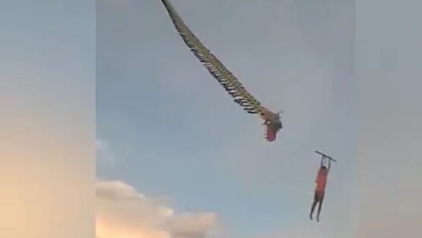 The boy began to fall when the dragon's head became detached from the body of the kite. A similar incident occurred in September when a 14-year-old boy fell after being lifted off the ground by a kite. (Facebook/ Video Screenshot)