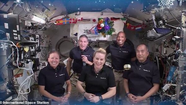 A can of mackerel donated by Japanese schoolgirls floats around the cabin as the crew of Expedition 64 ring in the Christmas holiday from aboard the International Space Station. (International Space Station)