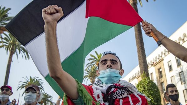 Moroccans wave the Palestinian flag during a demonstration against Israel-UAE-Bahrain normalization agreements in the capital Rabat, September 18, 2020. (Fadel Senna/AFP)