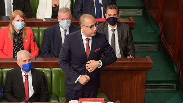 Hichem Mechichi, Prime Minister-designate of Tunisia, stands to deliver a speech to members of parliament in the capital Tunis on September 1. (AFP)