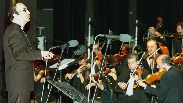 In this file photo taken on March 17, 2000, Lebanese maestro Elias Rahbani conducts his orchestra during a concert at the Casino du Liban. Lebanese media reported the death of Elias Rahbani, one of the leading pop musicians of the Arab world who is in his early 80s, after a long struggle with illness on January 4, 2021. Joseph BARRAK / AFP