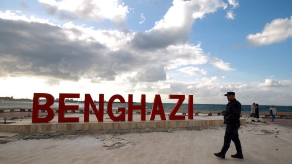 A Libyan security guard walks on the seaside promenade in the eastern Libyan coastal city of Benghazi on January 13, 2021. Libya negotiations hosted by the United Nations resumed in Geneva today. Abdullah DOMA / AFP