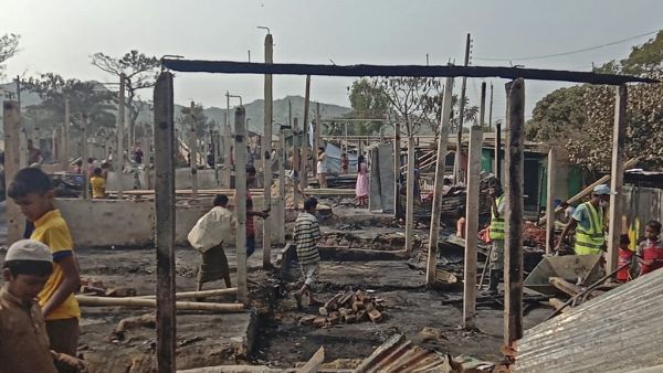 Rohingya refugees search for their belongings after a fire broke out at Nayapara refugee camp in Teknaf on January 14, 2021. AFP