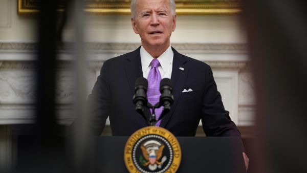 US President Joe Biden speaks about the Covid-19 response before signing executive orders in the State Dining Room of the White House in Washington, DC, on January 21, 2021.  MANDEL NGAN / AFP