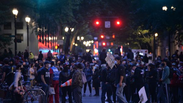 Protestors gather en masse to express outrage over federal interference on July 18. Photo: Ankur Dholakia/AFP via Getty Images