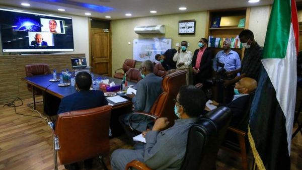 Sudan's Minister of Irrigation and Water Resources Yasir Mohamed takes part in a video meeting at the ministry in Khartoum on June 9, 2020, over the Grand Ethiopian Renaissance Dam. (AFP)