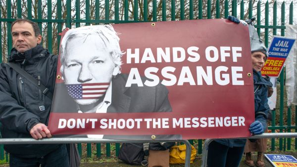 Protesters gather outside Belmarsh Prison, in support of the Free Julian Assange Campaign on the day of the WikiLeaks founder's extradition to the USA court hearing. (Shutterstock/ File Photo)