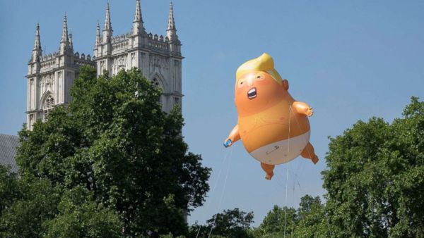 A giant inflatable balloon depicting President Trump as a baby in a nappy is flown over Parliament Square in London, July 13, 2018. (Shutterstock)