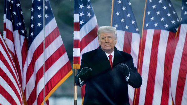 In this file photo taken on January 06, 2021, US President Donald Trump greets supporters on The Ellipse near the White House on January 6, 2021, in Washington, DC. Donald Trump will face an second impeachment trial in the Senate over the January 6, 2021, ransacking of the US Capitol after the impeachment article against the former president is sent to the chamber on January 25, 2021, its Democratic leader Chuck Schumer announced. Brendan Smialowski / AFP