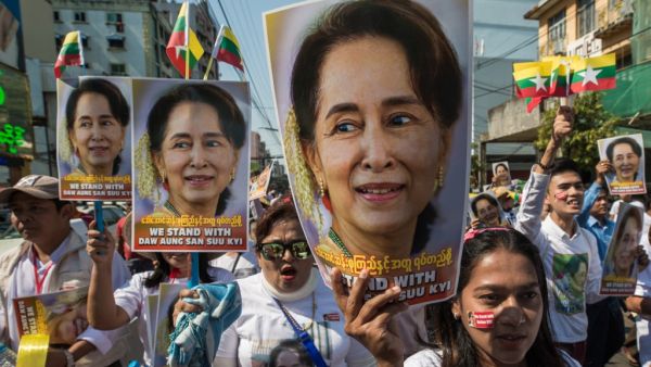 In this file photo taken on December 10, 2019 people participate in a rally in support of Myanmar's State Counsellor Aung San Suu Kyi, as she prepares to defend Myanmar at the International Court of Justice in The Hague against accusations of genocide against Rohingya Muslims. Myanmar's military has detained the country's de facto leader Aung San Suu Kyi and the country's president in a coup, a spokesman for her ruling party said February 1, 2021.  Sai Aung Main / AFP