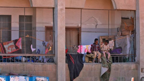 Boys sit together inside a school building for displaced Yemenis who fled fighting between Huthi rebels and the Saudi-backed government forces, in the town of al-Turba in Taez governorate on February 4, 2021. AHMAD AL-BASHA / AFP