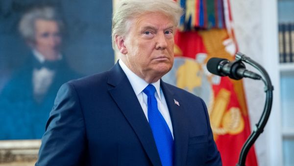 In this file photo taken on December 7, 2020 US President Donald Trump looks on during a ceremony presenting the Presidential Medal of Freedom to wrestler Dan Gable in the Oval Office of the White House in Washington, DC. Here we go again. The defendant in the coming week's impeachment trial -- Donald Trump -- remains the same, but several leading figures in the Senate proceedings have changed from the previous effort to oust the now-former president. So, too, have the charges. Trump was impeached in Decemb
