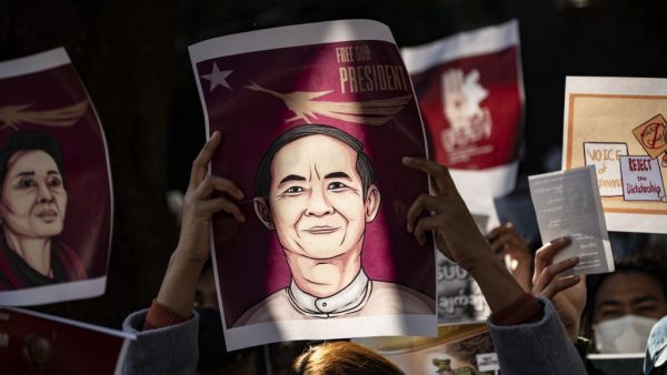 Myanmar activists hold an image of their country's civilian president Win Myint as they protest outside the Myanmar embassy in Tokyo on February 7, 2021, after the country's military on February 1 seized power in a bloodless coup and detained its civilian leader Aung San Suu Kyi. Philip FONG / AFP