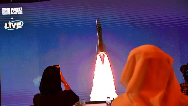 This file photo taken on July 19, 2020, shows a screen broadcasting the launch of the "Hope" Mars probe at the Mohammed Bin Rashid Space Centre in Dubai. The first Arab interplanetary mission is expected to reach Mars' orbit on February 9, 2021, in what is considered the most critical part of the journey to unravel the secrets of weather on the Red Planet. The unmanned probe -- named "Al-Amal" -- Arabic for "Hope" -- blasted off from Japan last year, marking the next step in the United Arab Emirates' ambiti