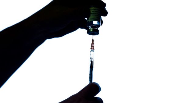 A health worker prepares an injection of the AstraZeneca/Oxford Covid-19 vaccine on February 7, 2021 at the Mignot Hospital in Le Chesnay near Paris. The top French medical authority Haute autorité de Santé has approved the vaccine for use in France, but only for people under 65, echoing decisions made in Sweden, Germany, Belgium and Switzerland over concerns about a lack of data on the effectiveness of the vaccine for over 65s.  ALAIN JOCARD / AFP