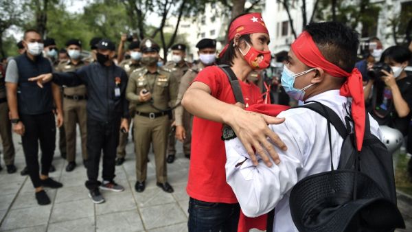 This photo taken on February 7, 2021, shows Myanmar migrants protesting against the military coup in their home country, in Bangkok. Organising protests, gathering supporters and distributing posters of their beloved leader Aung San Suu Kyi, Myanmar workers in Thailand are adding to a chorus of dissent against a coup that has upended their home country.  Lillian SUWANRUMPHA / AFP