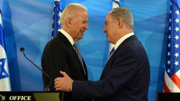 In this file photo taken on March 09, 2016, US Vice President Joe Biden and Israeli Prime Minister Benjamin Netanyahu shake hands while giving joint statements at the prime minister's office in Jerusalem. President Joe Biden will talk "soon" with Israeli Prime Minister Benjamin Netanyahu but has no "specific" plan to do so yet, the White House said on February 11, 2021, underlining an apparent distancing in the key relationship.  DEBBIE HILL / POOL / AFP