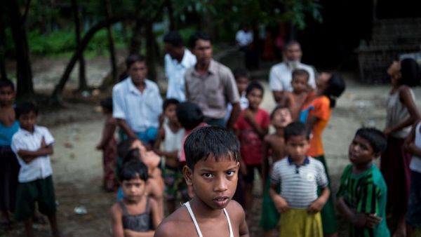 In this file photo taken on September 27, 2017, Rohingya Muslims gather at Pan Taw Pyin village in Maungdaw in Myanmar's northern Rakhine state. Myanmar's stateless, conflict-scarred Rohingya community are on edge with the return of military rule, fearing further violence in a restive part of the country where others have shown support for the new regime. STR / AFP