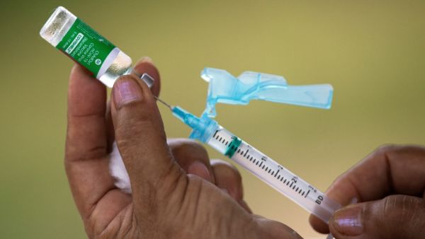  In this file photo taken on February 9, 2021 nurse Janete Da Silva Oliveira prepares a dose of Oxford-AstraZeneca COVID-19 vaccine in the Nossa Senhora Livramento community on the banks of the Rio Negro near Manaus, Amazonas State, Brazil. The vaccination campaign against COVID-19 that began a month ago in Brazil has been hampered by the lack of available doses and a cacophony due to the lack of national coordination from the Bolsonaro government. The mayor of Rio de Janeiro, Eduardo Paes, said on February